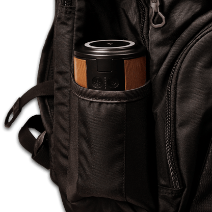 Image of the power station in the water bottle holder of a black backpack.